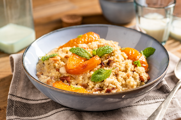 A bowl of cooked millet groats with fruit